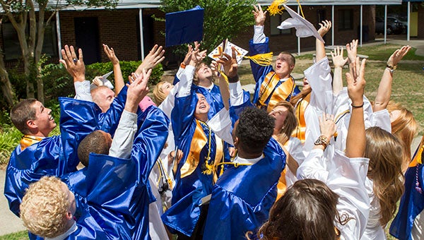 Southampton Academy students toss their caps in the air and prepare for the future. The Class of 2015 will be attending colleges as close as Chowan University, and as far away as Virginia Tech and Salisbury University in Maryland. Others will attend colleges such as North Carolina State University, James Madison University and East Carolina University. -- Cain Madden | Tidewater News