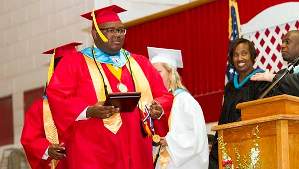 Malik Phillips walking off stage after being recognized as Southampton High School’s first Gates Millennium Scholar. He will attend the University of Virginia in the fall. -- CAIN MADDEN | The Tidewater news