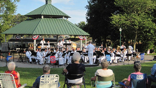 Members of the community brought lawn chairs to Barrett’s Landing last year for the U.S. Navy Fleet Forces Wind Ensemble Band. -- FILE PHOTO