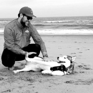 Andrew with his three-year-old Siberian Husky, Melo, at the Virginia Beach Oceanfront just weeks after they moved to the area. SUBMITTED | KAYLA RICE