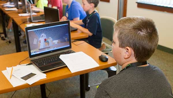 Miller Zurfluh, along with other summer campers at Paul D. Camp Community College, played Minecraft as part of a STEM program that focused in part on engineering skills. -- CAIN MADDEN | THE TIDEWATER NEWS
