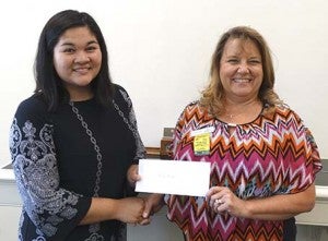 Jena Araojo receives the Donna C. McCullough Chamber scholarship from Kim Williams of EVB. Araojo graduated this past June from Southampton High School, and is going to The College of William and Mary this fall. -- SUBMITTED