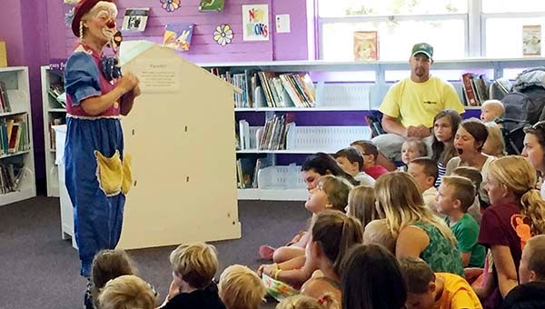 Joy the Clown performs magic tricks while teaching her audience of young readers the importance of reading, obeying one’s parents and practicing kindness. -- Walter Francis Jr. | Tidewater News