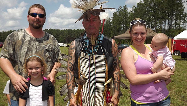 Families are invited to attend the Green Corn Dance Powwow of the Cheroenhaka Indians this Saturday from 10 a.m. to sunset. Pictured from last year’s event are Joshua Crickenberger, Lyndsee Crickenberger, Mike “Thunderdancer” Cranford, Lisa and Emma Crickenberger of Dreweryville. - FILE