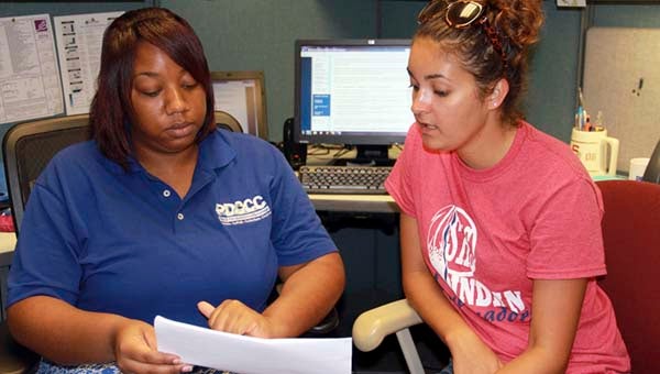 High School Career Coach Supervisor Candace Artis discussing the options of dual enrollment with high school student Marissa Haydu. -- SUBMITTED