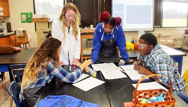Franklin High science teacher Leslie Moring teaching her students concepts to identify the pH of five unknown household chemicals. She is the recipient of the 2015 RISE award in the biology category. - SUBMITTED