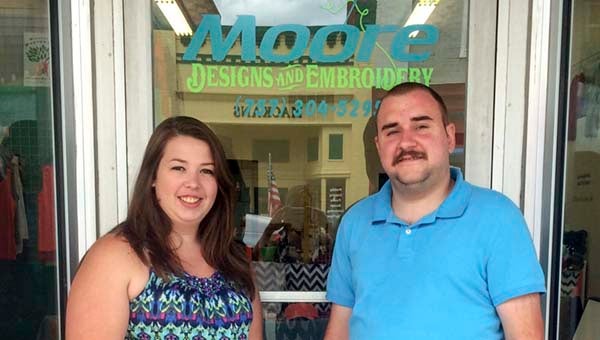 Jessica and Kevin Moore, owners of Moore Design and Embroidery in Downtown Franklin. - Rebecca Chappell | Tidewater News
