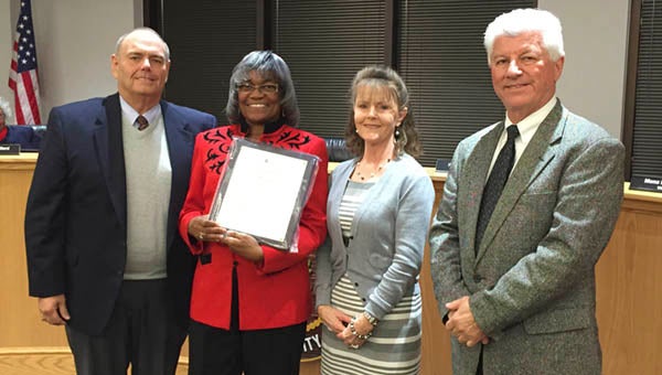 Marcellia A. Taylor, along with three other City employees who were unable to attend the City Council meeting on Monday night, received a retirement Resolution of Appreciation. Pictured from left: Vice Mayor Barry Cheatham,  former Temporary Secretary III and Accounting Clerk Marcellia A. Taylor, Secretary Dinah Babb and City Manager Randy Martin. -- Rebecca A. Taylor