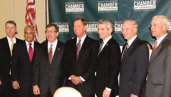 Posing for a group photo during the Hampton Roads Chamber of Commerce’s congressional forum Wednesday at the Chesapeake Conference Center are, from left, Rep. Rob Wittman, Rep. Bobby Scott, Chamber Board of Directors Chair Joe Witt, Chamber President and Chief Executive Officer Bryan Stephens, Rep. Scott Rigell, Rep. Randy Forbes and Charlie Henderson, Hampton Roads market president of Bank of America, the event’s presenting sponsor. -- Tracy Agnew | Suffolk News-Herald