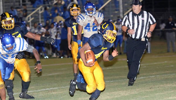 Franklin running back Javonte Baker breaks through the line for a successful two-point conversion in the first quarter of Friday night's game against Brunswick. -- Frank Davis | Tidewater News