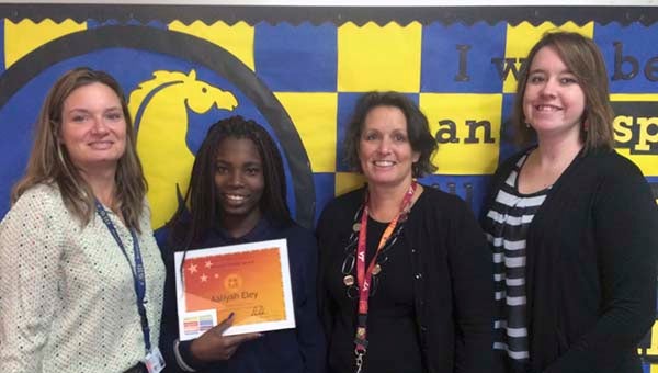 Seventh grade student Aaliyah Eley of J.P. King Jr. Middle School won the SuccessMaker National Scholar of the Week for having the greatest national gain in SuccessMaker Reading. Pictured from left to right are reading specialist Mauren Mahoney, Aaliyah Eley, seventh grade teacher Kathy Jo Edwards and reading specialist Stephanie Cox.