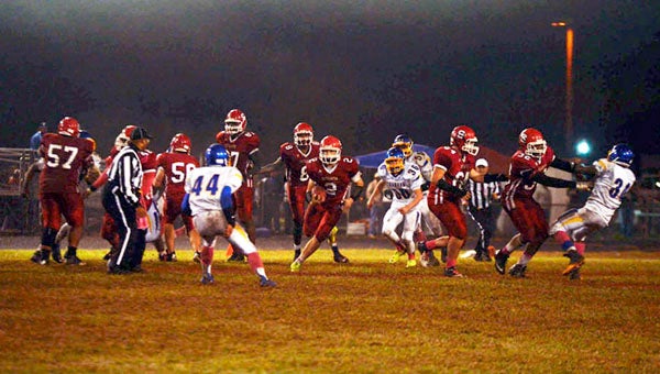Southampton running back Harrison Ehrenzeller (2) rushes up the middle for a long gain while his fullback Jonathan Hall (32) decleats a defender. The backfield mates combined to rush for more than 170 yards and three touchdowns in Friday night’s win over Surry. -- Murray Thompson | Tidewater News