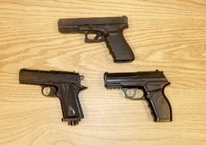 The gun on top is the kind that the Franklin police officers carry around with them on a daily basis. The guns on the bottom are ones that the officers have taken from suspects that have proved to be fake. -- Rebecca Chappell| Tidewater News