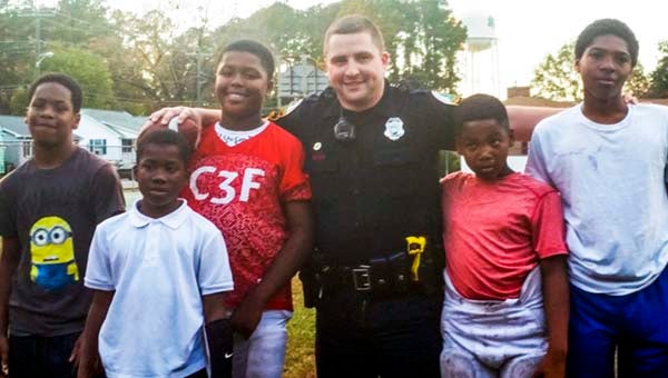 Officer Josh Butts with the Franklin Police Department stopped by the College Drive Park and enjoyed a football game with children of the community. -- Submitted | Jheresa Richardson