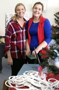 Taylor and Lindsey Morris shopping at Moore Designs and Embroidery on Saturday at the Christmas Open House in Downtown Franklin. -- SUBMITTED