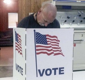 Bill Vick of Courtland casts his ballot at the Courtland Volunteer Fire and Rescue Squad building on Tuesday. Vick didn’t not elaborate on his feelings for the candidates, but said that residents should have no problem deciding between the choices. -- ANDREW LIND | The Tidewater news
