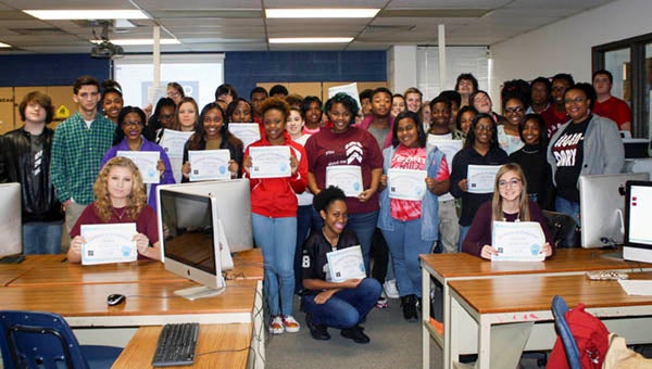 Southampton’s Natasha Preau, right, stands with her desktop publishing class and Melissa Edwards’ graphic design class after they received certification for completing the “Hour of Code” challenge during Computer Science Education Week. -- SUBMITTED | MELISSA EDWARDS