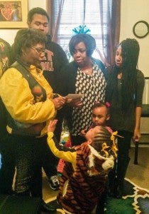 The Myrick family was very appreciative as Michelle Roberts, business manager for the Tiger Riders Motorcycle Club, handed them a check to use for the Christmas holiday. -- Rebecca Chappell | Tidewater News