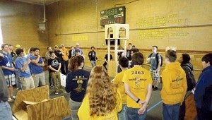 In FIRST Stronghold, the teams have the quest to overcome opponents’ defenses and throw boulders (gray-colored balls) through the tower to earn points. -- STEPHEN H. COWLES | The Tidewater news 