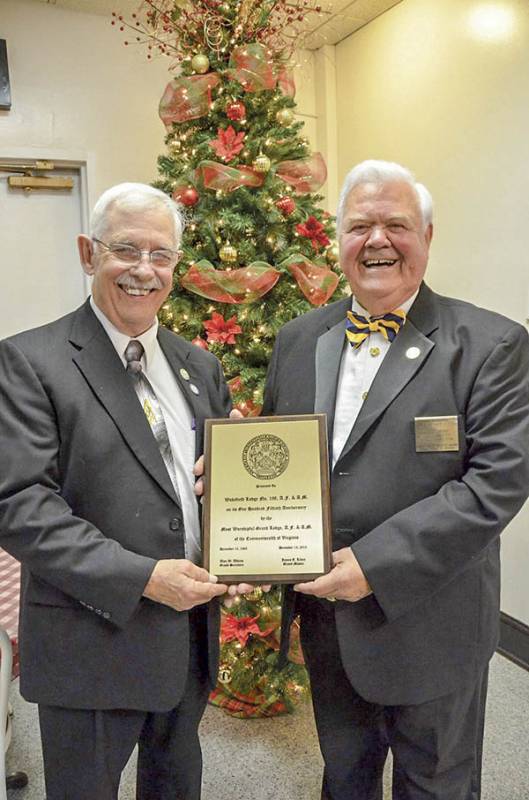 Right Worshipful William E. Allmond III, left, accepts the plaque recognizing Wakefield Masonic Lodge No. 198 A.F. & A.M. for its 150th year anniversary from Most Worshipful James E. Litten, 171st Grand Master of Masons in Virginia. -- SUBMITTED