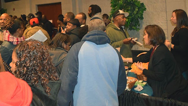 Hundreds of people filled the PDCCC Regional Workforce Development Center on Wednesday to attend the job fair, talk to companies, fill out applications and make connections. - Rebecca Chappell | Tidewater News