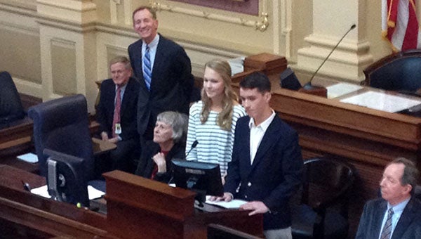 Luke Denoncourt from Windsor is helping to lead the pages for the Virginia General Assembly's House of Delegates this session. With him is Libby Clinger as they announced the pages' names on the first day of orientation.
