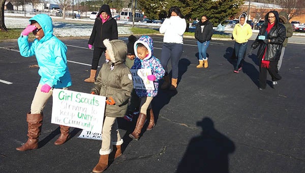Members of Boykins Girl Scout Group No. 5073 lead their 6th Annual “Keep Unity in Our Community Walk” at PDCCC on Monday. Pictured are scouts Chloe Pope, Sydney Ivey, A’Layla Peterson, Erykah Harris, Cheryl Tanner and Kisha Watford. Also pictured are parents and past scout Shernae Earls. -- SUBMITTED