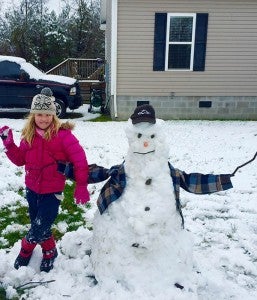 Wynsten Lee, 5, built her first snowman of 2016 in Sedley. -- SUBMITTED | BECCA LEE