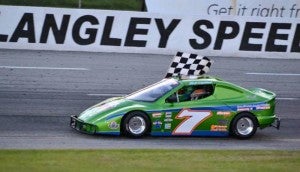 Zach holds the checkered flag at Langley Speedway. -- COURTESY | KING CHARLES PHOTOGRAPHY