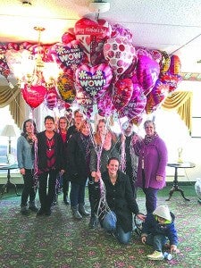 Members of Elevate Church brought balloons and cards to residents at the Consulate Health Care in Windsor. In front are Tricia Orilio and her son, Alex; back, from left, are Becke West, Teresa Cobb,Lisa Speight, Karla Cobb,Cindy Shelton, Hanna Shelton, William “Bill” Blake, Nell Cyr; and way in back is Randy Bryant.