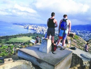 Fellow visitors man the watch tower atop Diamond Head.
