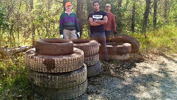 Members of the Nottoway Indian Tribe of Virginia helped to dispose of several tractor-trailer tires that had been dumped at the state boat facility at Careys Bridge. -- Submitted | Jeff Turner