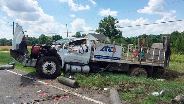 When this truck overturned earlier on Tuesday afternoon, gas cylinders were knocked loose and fell out, blocking Walters Highway. -- Submitted