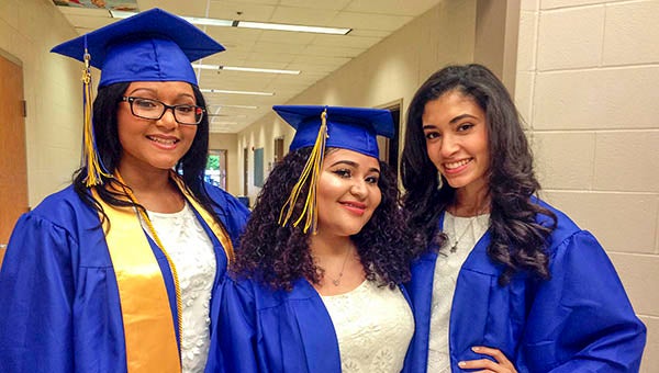 From left are Nyah Seaborne, Daisy Scott and Kelly Lewis just before they get ready to march into the gymnasium for their graduation. Kelly said that she hopes to travel this summer before going to George Mason University to study engineering. -- Stephen H. Cowles | Tidewater News