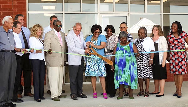 The Board Members of Southeastern Virginia Health System, along with Franklin mayor-elect Frank Rabil (center-left), cut the ribbon to open the new Franklin Community Health Care Center.