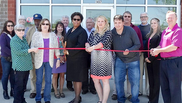 AJ Southern Insurance Company had its ribbon-cutting ceremony on May 16. Pictured from left are Roberta Bowman, Chaplain Judy Worrell, Teresa Beale, David Price, Linda Hall, Juanita Richards, city manager Randy Martin, Mayor Raystine Johnson-Ashburn, Blake Blythe, Anita Hall Justice, Brian Justice, Jim Strozier, Greg Cook, Kellie Moore and Dan Howe. -- SUBMITTED