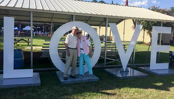 Charles and Nancy Bunn of Newsoms show some “LOVE” at last year’s Franklin Southampton County Fair. -- SUBMITTED