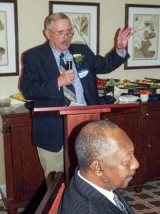 Clyde Parker accepted the posthumous honors for Colgate W. Darden Jr., as well as the one for William H. Goodwin Jr., who could not attend the ceremony. Committee chairman Herman Charity is seated up front.