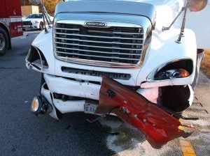 The outer shell of the driver's door stuck to this tractor-trailer after the Ford had pulled out in front oncoming westbound traffice at the intersection of Drewry Road and Southampton Parkway.