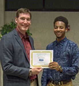 Bakari Jenkins of Suffolk accepts his award certificate from College President Dr. Dan Lufkin. -- Submitted