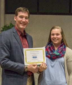President Lufkin congratulates Olivia Davis of Courtland on her award. -- Submitted