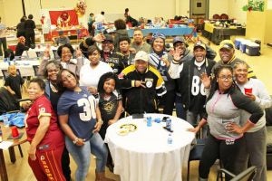 The Rev. Melvin Murphy, pastor of United Christian Community Church, with a host of participants who all enjoyed the three F’S — an evening of food, fellowship and, of course, football. -- Frank A. Davis | Tidewater News